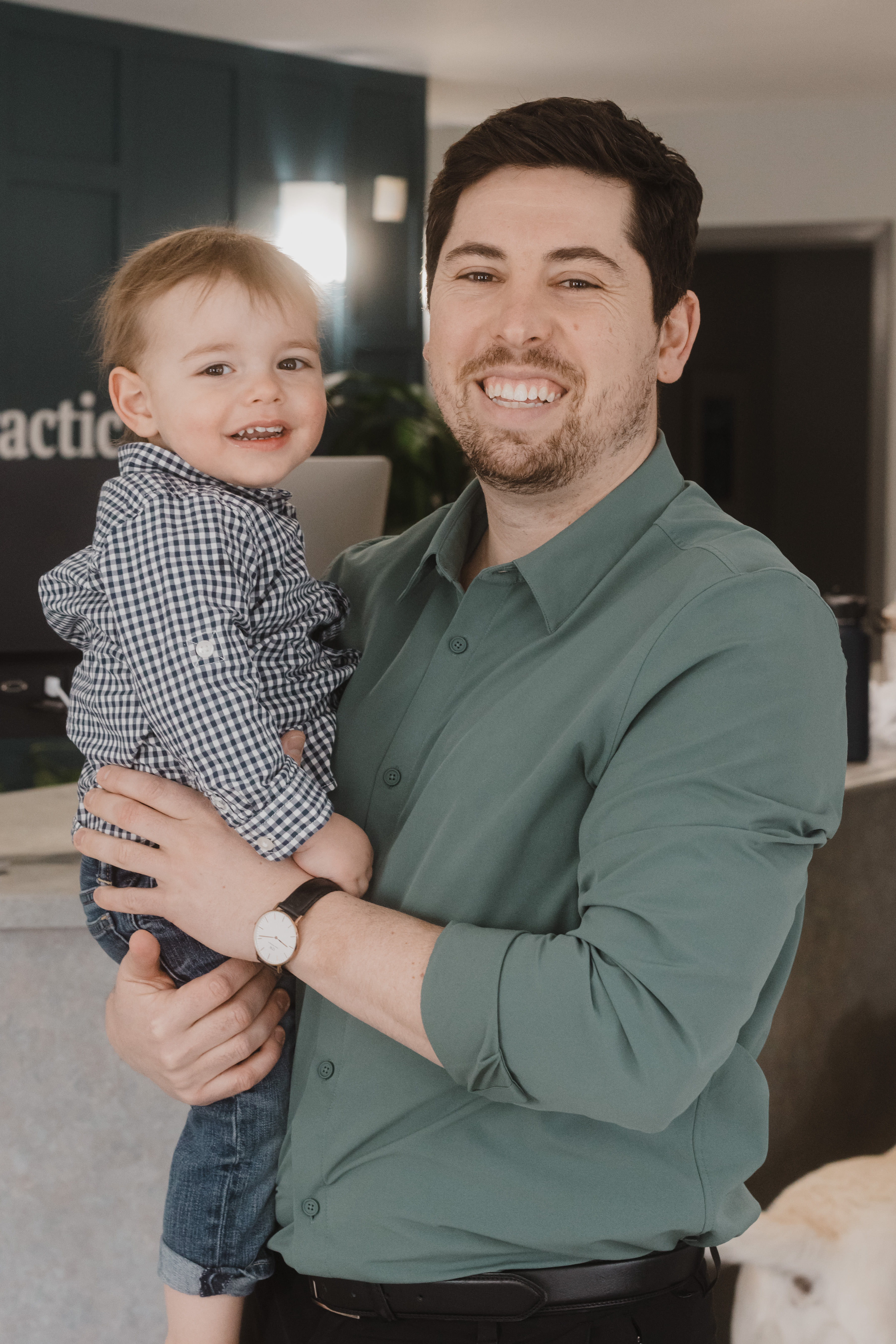 Dr. Ben holding his son Brett